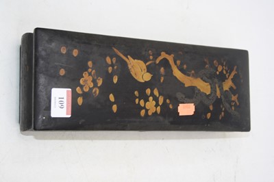 Lot 109 - A 1920s black lacquered and gilt decorated...