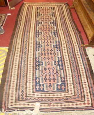 Lot 1135 - A Turkish woollen rug, having a stepped...