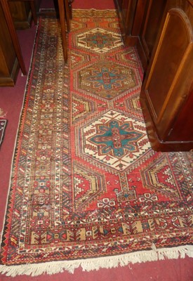 Lot 1138 - A Persian woollen red ground Ardabil rug, 255...