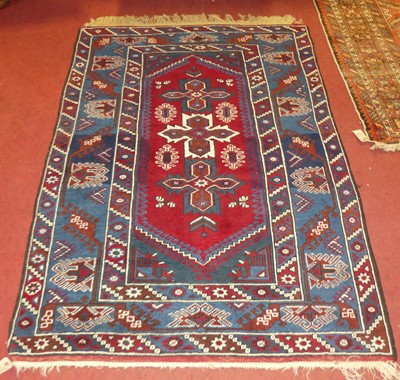 Lot 1139 - A Persian red and blue ground Shiraz rug, 180...