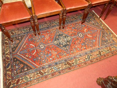 Lot 1142 - A Persian woollen red ground Malayer rug, 200...