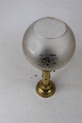 Lot 137 - An early 20th century brass pedestal candle...