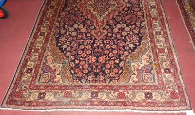 Lot 1152 - A Persian woollen Sarouk rug, 220 x 130cm