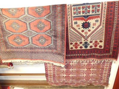 Lot 1153 - A Persian red ground woollen Bokhara rug;...