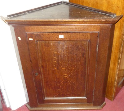 Lot 1159 - A 19th century oak single door hanging corner...