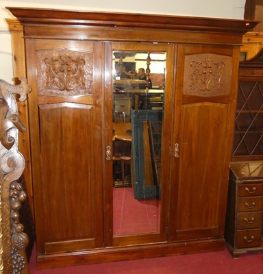 Lot 1168 - An Edwardian walnut three door wardrobe,...