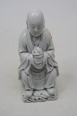 Lot 194 - A Chinese blanc de chine figure of a seated...