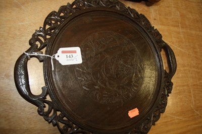 Lot 143 - A 20th century oak tray of circular form...