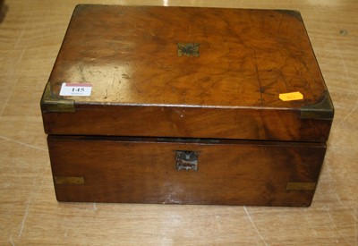 Lot 145 - A Victorian walnut and brass bound writing...