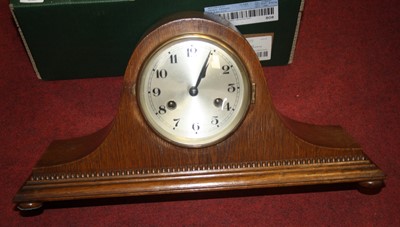 Lot 163 - A 1920s oak cased mantel clock having a...