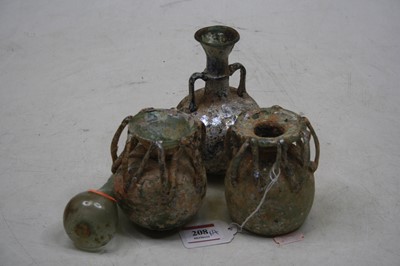 Lot 208 - Roman iridescent glassware, comprising a pair...