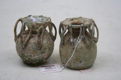 Lot 208 - Roman iridescent glassware, comprising a pair...