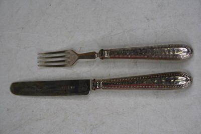 Lot 234 - A cased 12-place setting of silver bladed...