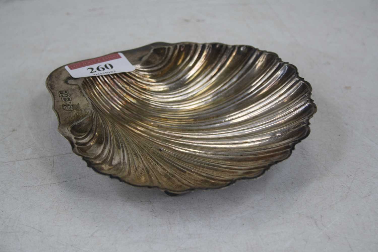 Lot 260 - A late Victorian silver shell shaped butter...
