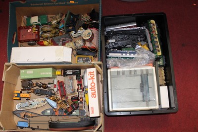 Lot 563 - Three boxes of assorted toys to include 00...