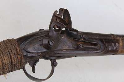 Lot 295 - A 19th century Eastern flintlock musket,...