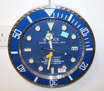 Lot 618 - After Rolex, reproduction wall clock based on...