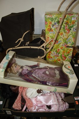 Lot 579 - A black composition baby doll having rolling...