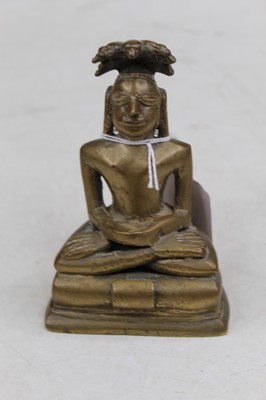 Lot 357 - A bronzed figure of a deity in seated lotus...