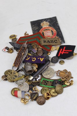 Lot 378 - A collection of cap badges and buttons to...