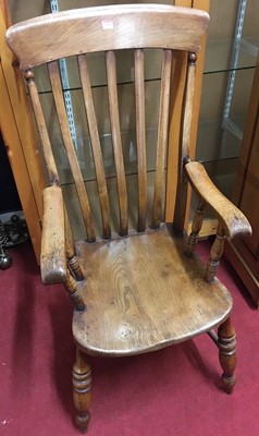 Lot 1105 - An early 20th century elm and beech slatback...