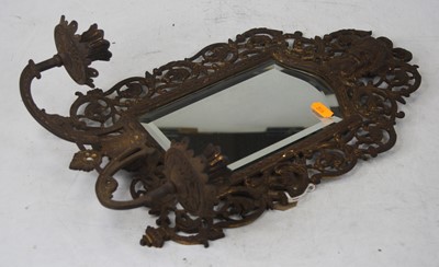 Lot 495 - A cast metal wall mirror having twin candle...