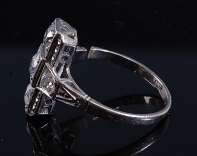 Lot 2160 - A white metal Art Deco diamond panel ring,...