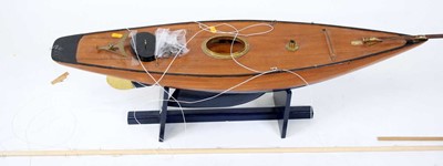 Lot 99 - A wooden kit built model of a sailing boat,...