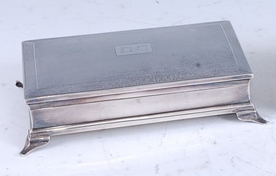 Lot 210 - An Art Deco silver table cigarette box, having...