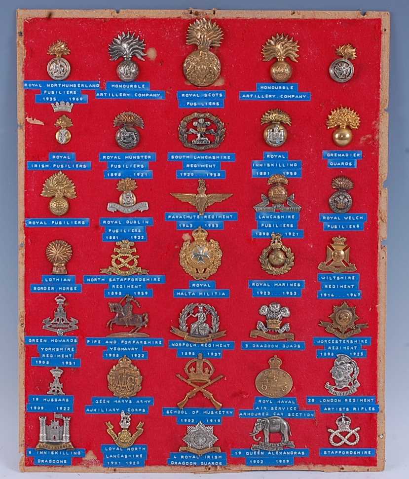 Lot 235 - A collection of cap badges and insignia to...