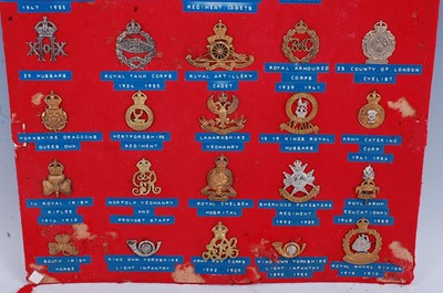 Lot 234 - A collection of cap badges and insignia to...