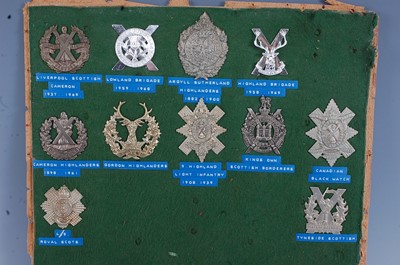 Lot 233 - A collection of cap badges, glengarry badges...