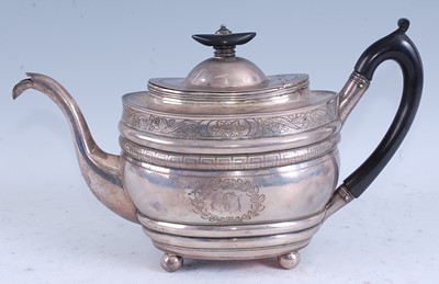 Lot 2106 - A late Georgian silver teapot, of ribbed oval...