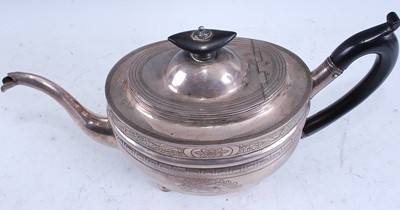 Lot 2106 - A late Georgian silver teapot, of ribbed oval...