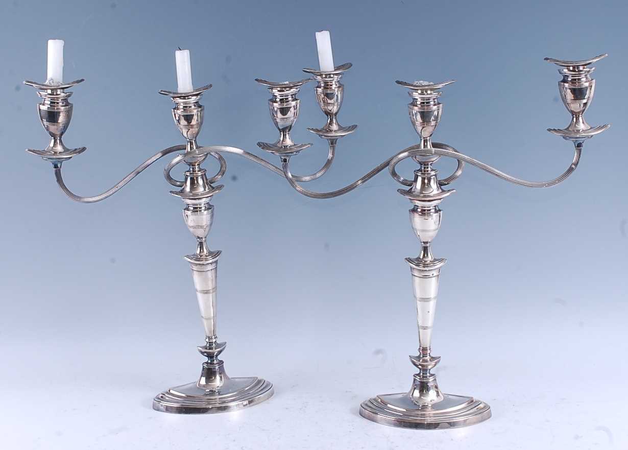 Lot 101 - A pair of circa 1900 silver plated three-light...