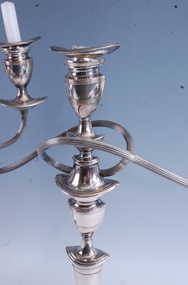 Lot 101 - A pair of circa 1900 silver plated three-light...