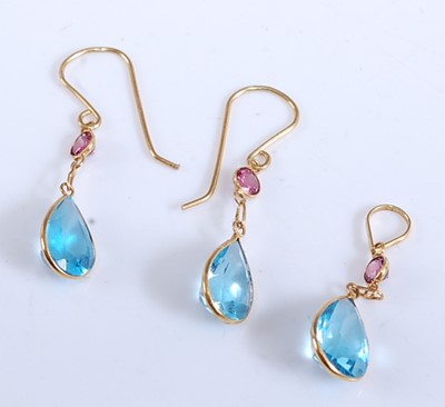 Lot 1170 - A pair of yellow metal, blue topaz and garnet...