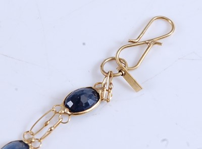 Lot 1171 - A yellow metal sapphire bracelet, comprising...