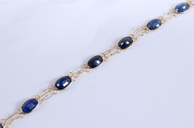 Lot 2189 - A yellow metal sapphire bracelet, comprising...