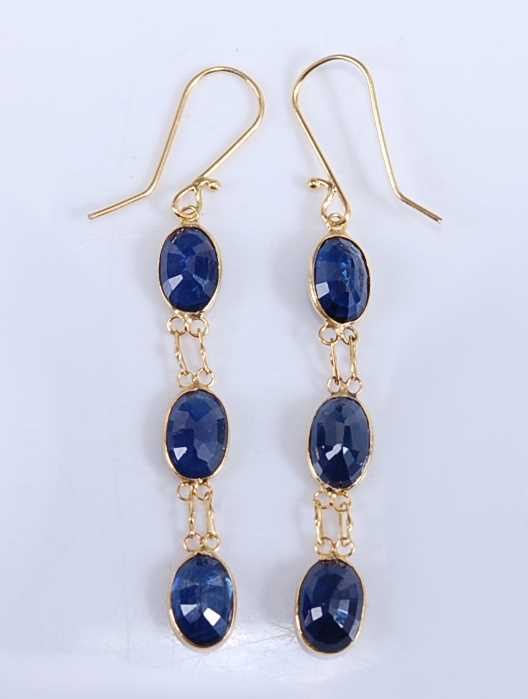 Lot 2193 - A pair of yellow metal sapphire drop earrings,...