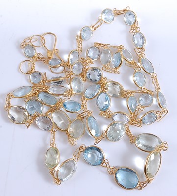 Lot 2510 - A yellow metal aquamarine necklace, featuring...