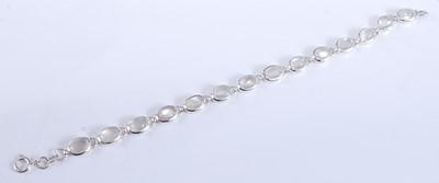 Lot 2505 - A white metal moonstone bracelet, with...