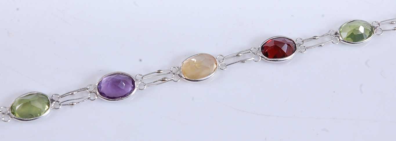 Lot 2513 - A white metal multi-stone bracelet, comprising...