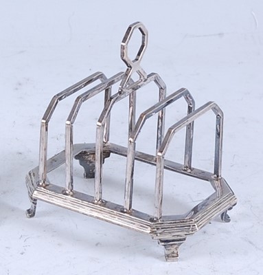 Lot 224 - An Art Deco silver four-division toast rack...