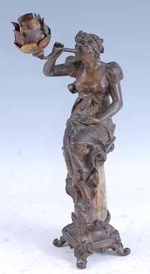 Lot 56 - A French Art Nouveau spelter and onyx table...