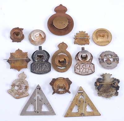 Lot 100 - A collection of military and related badges to...