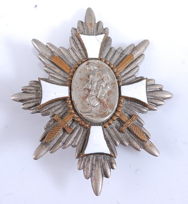 Lot 190 - A collection of four German badges to include...