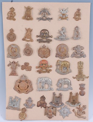 Lot 238 - A collection of cap and collar badges, to...