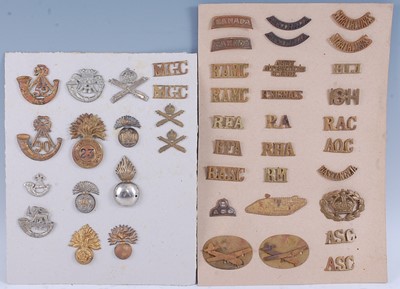 Lot 23 - A collection of cap badges to include 23rd...