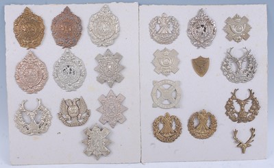 Lot 24 - A collection of glengarry badges to include...